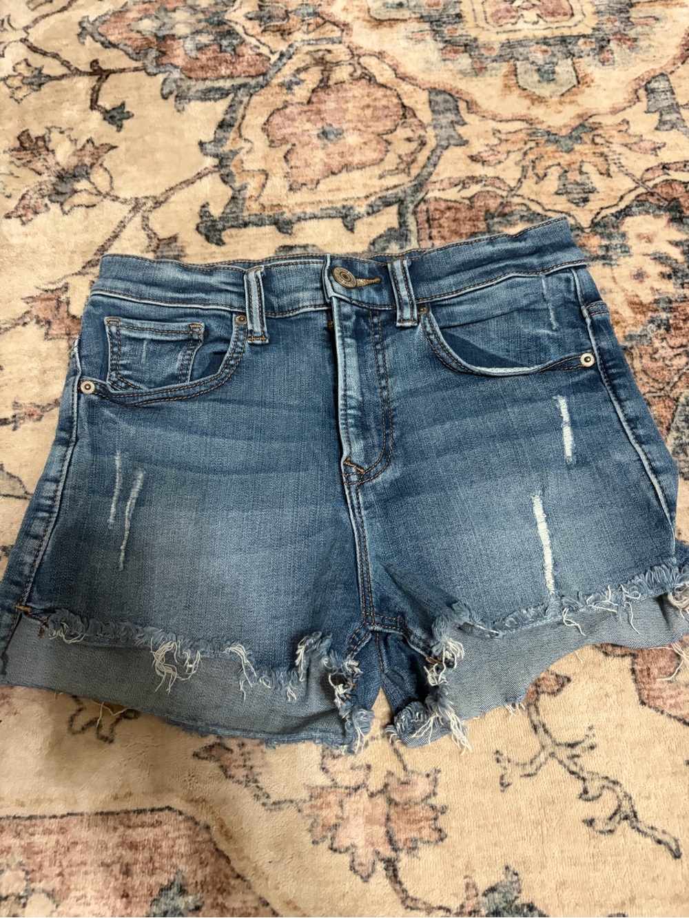 High-Rise Frayed Hem Denim Shorts in Blue